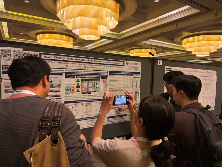 Attendees gathered around an ML3 research poster during a COLM 2026 poster session.