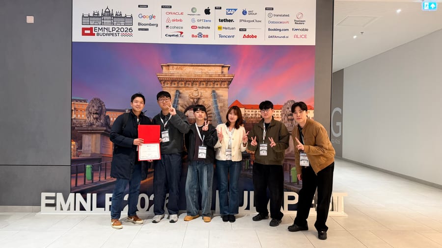 ML3 members posing together in front of the EMNLP 2026 conference backdrop.